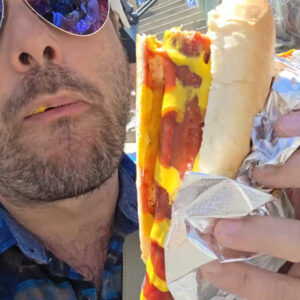Piero Armenti il fondatore de Il mio viaggio a New York mangia un hot dog pieno di senape e ketchup